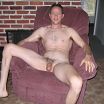 Naked and hairy on red recliner
