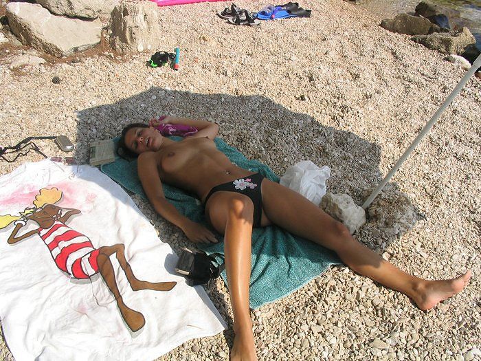 Topless beach girl